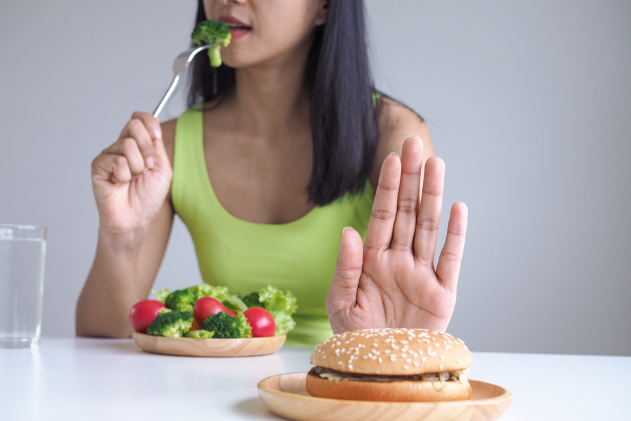 Woman Refusing to Eat Fast Food 